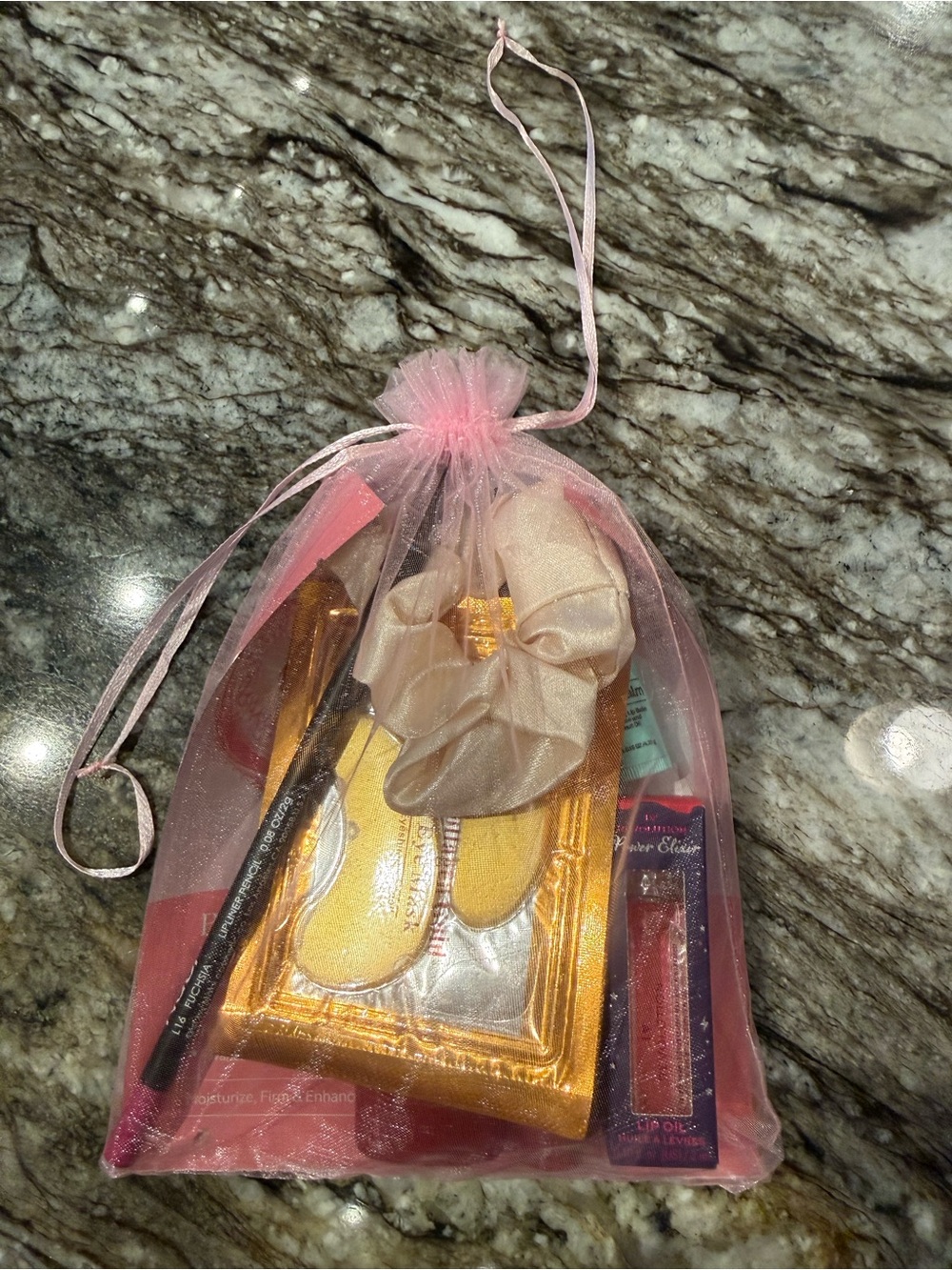 Pink Sheer Drawstring Gift Bag with Assorted Accessories